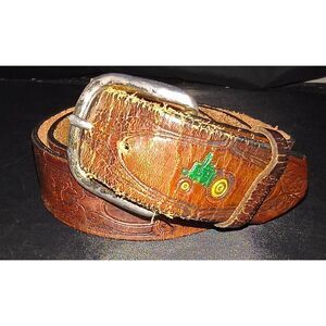 Tooled leather belt with a western vintage style, elaborate scroll design painte